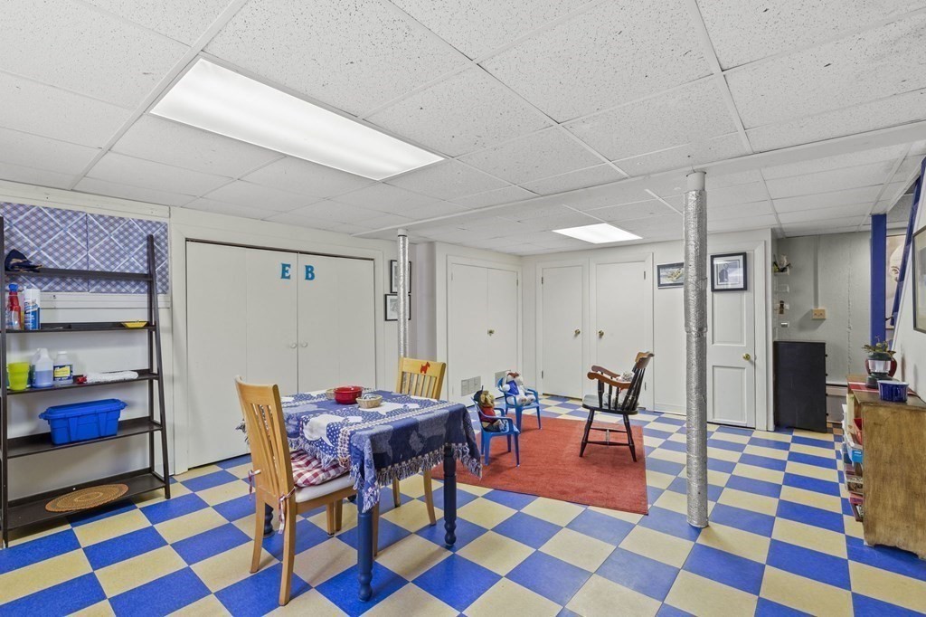 9 Lawrence Street Beverly, MA 01915 - Photo 27 of 42 a dining room with a table and chair