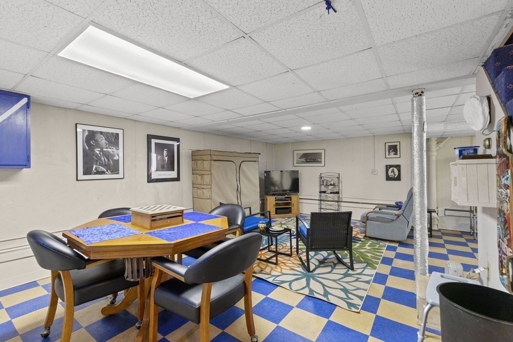 9 Lawrence Street Beverly, MA 01915 - Photo 29 of 42 a dining room with a table and chairs