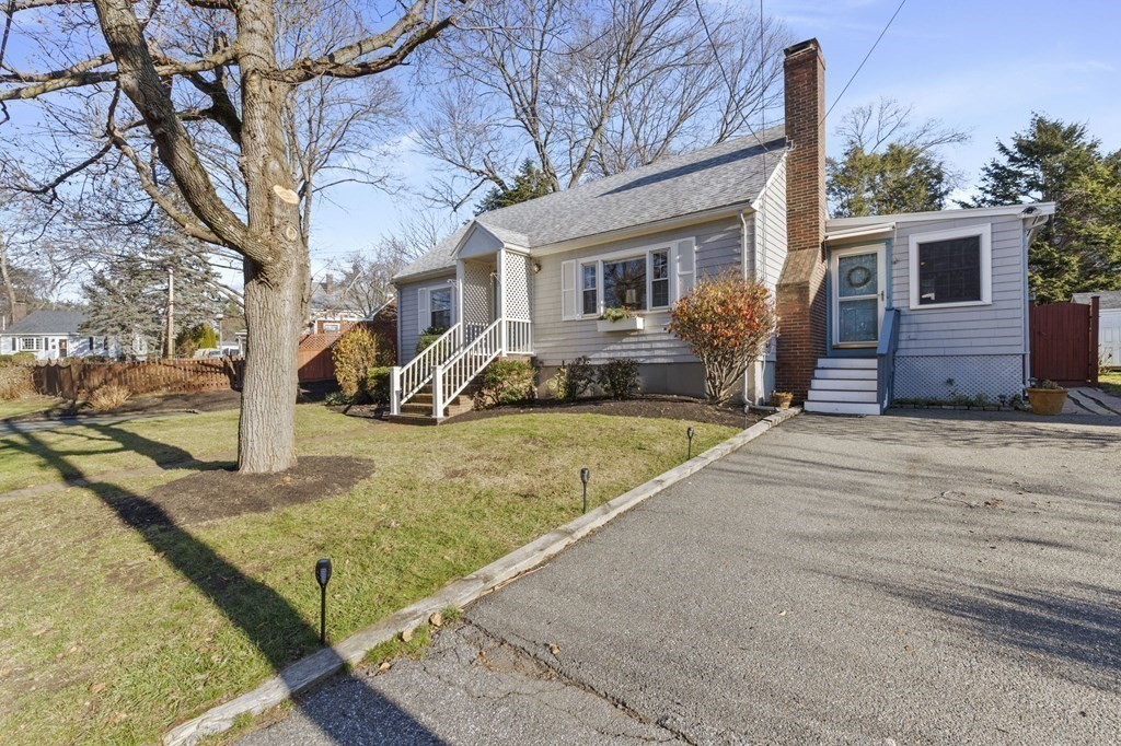 9 Lawrence Street Beverly, MA 01915 - Photo 36 of 42 a view of a house with a yard covered in snow