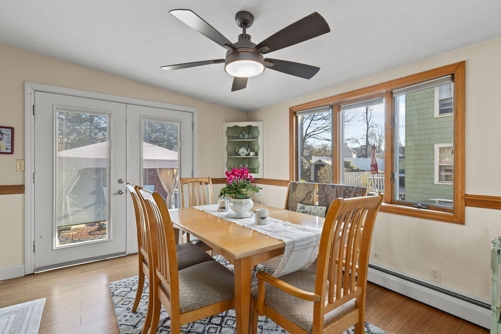 9 Lawrence Street Beverly, MA 01915 - Photo 6 of 42 a dining room with furniture a chandelier and wooden floor