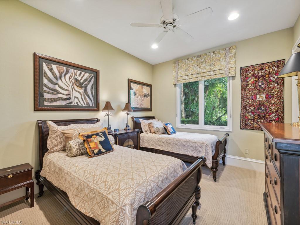 18112 Lagos Way Naples, FL 34110 - Photo 21 of 50 a bed room with furniture and a large window
