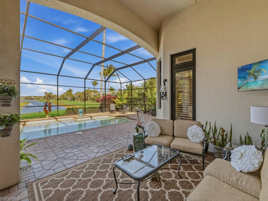 18112 Lagos Way Naples, FL 34110 - Photo 26 of 50 Covered Lanai w/ Fireplace