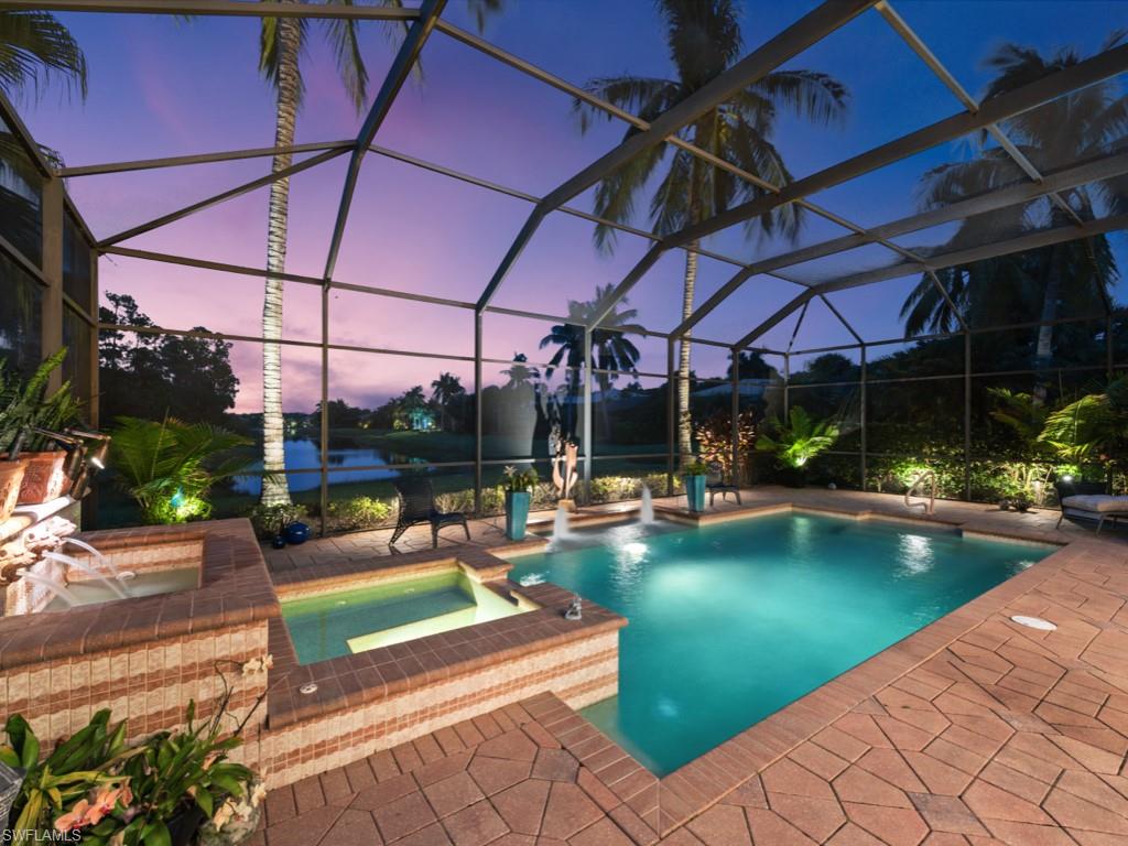 18112 Lagos Way Naples, FL 34110 - Photo 31 of 50 a view of a swimming pool with a patio