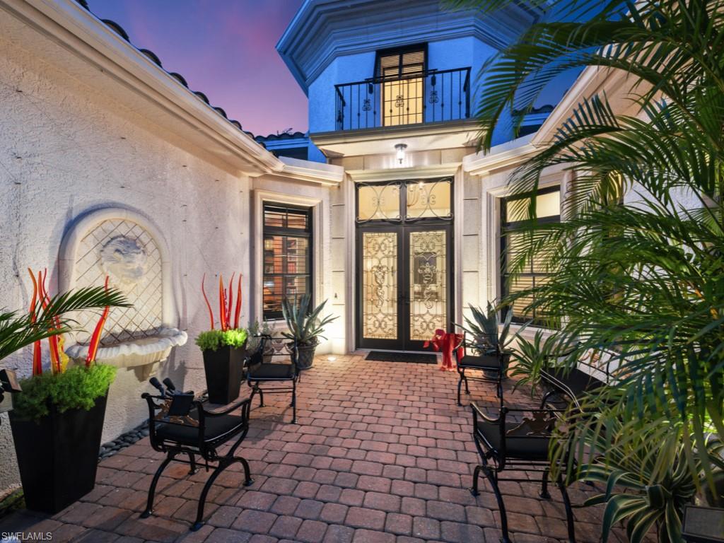 18112 Lagos Way Naples, FL 34110 - Photo 4 of 50 a view of a chairs and bench in a patio