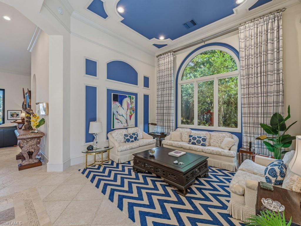 18112 Lagos Way Naples, FL 34110 - Photo 8 of 50 a living room with furniture a table and a potted plant
