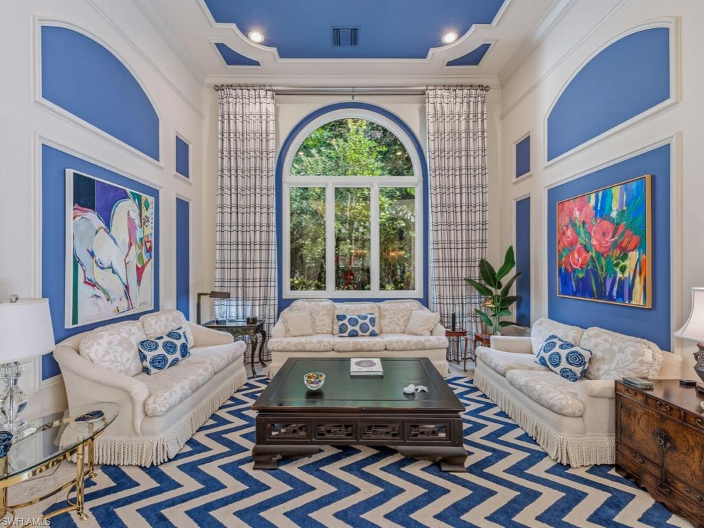 18112 Lagos Way Naples, FL 34110 - Photo 9 of 50 a living room with furniture and a large window