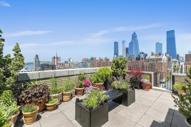 a city view with a chair and tables