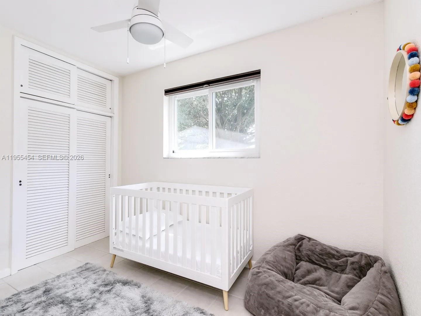 4800 Polk Street Hollywood, FL 33021 - Photo 16 of 26 a bedroom with a bed and a window