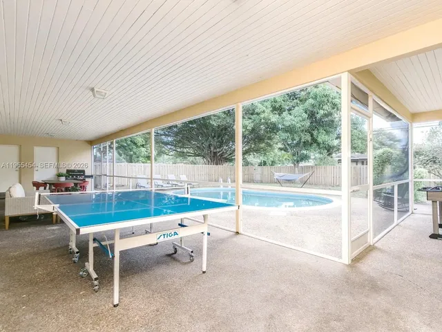 a bedroom with a bed and a table