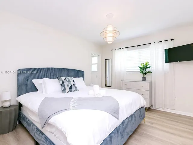 a bathroom with a sink vanity granite and toilet