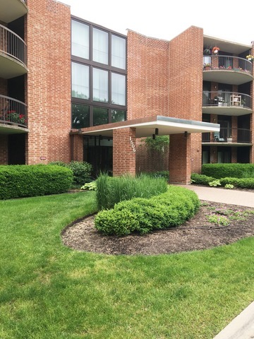 a view of a building with a yard