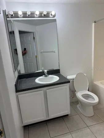 a bathroom with a shower and a bath tub