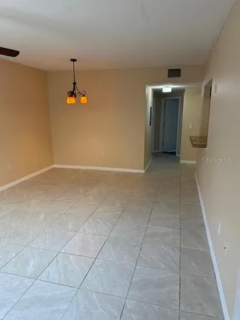 a view of a ceiling fan and a window