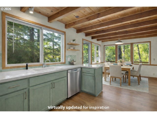 511 1st Street Manzanita, OR 97130 - Photo 28 of 28 a kitchen with a sink and large windows
