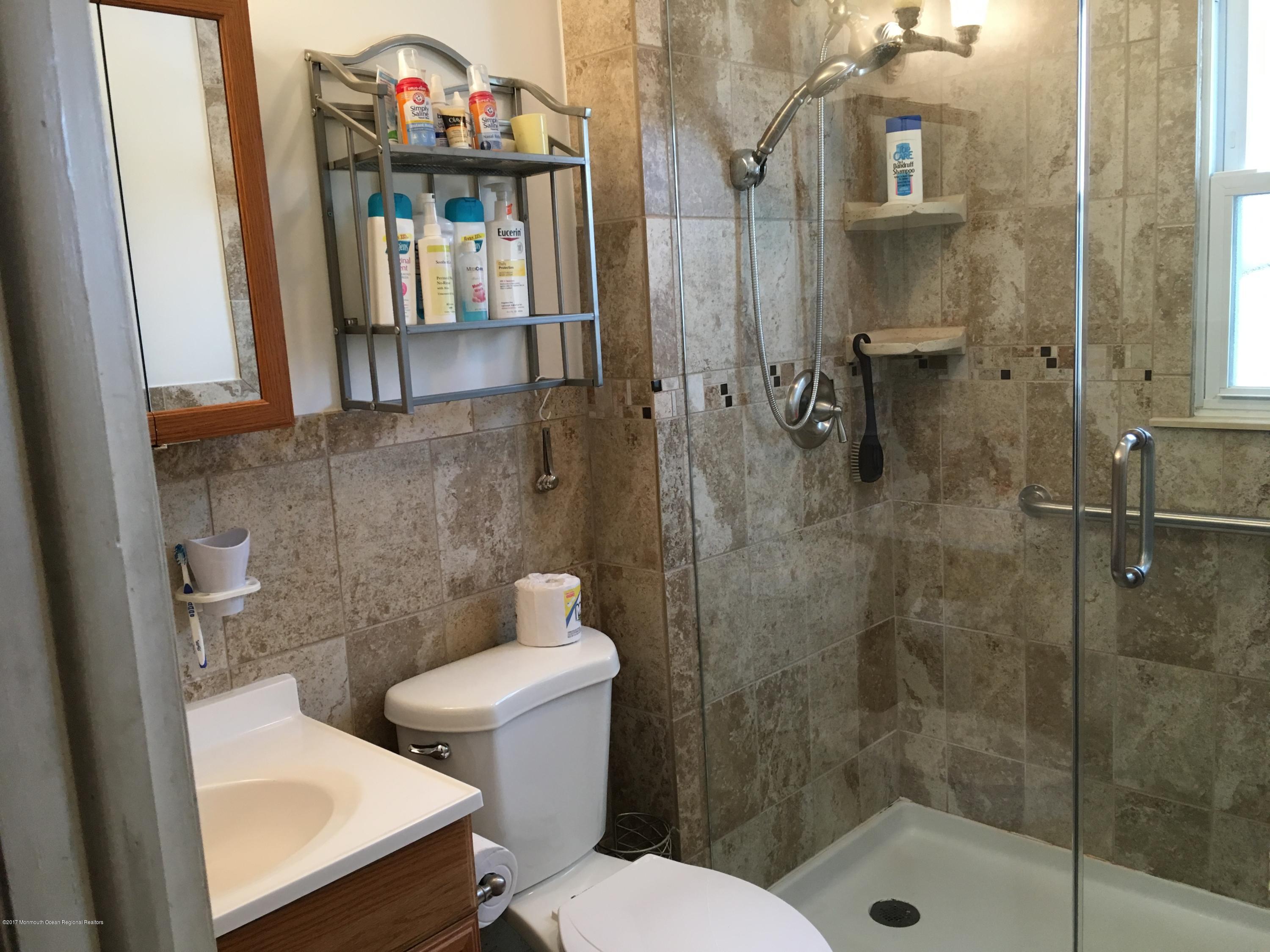 320 Eastham Road Point Pleasant, NJ 08742 - Photo 11 of 18 a bathroom with a toilet and a shower
