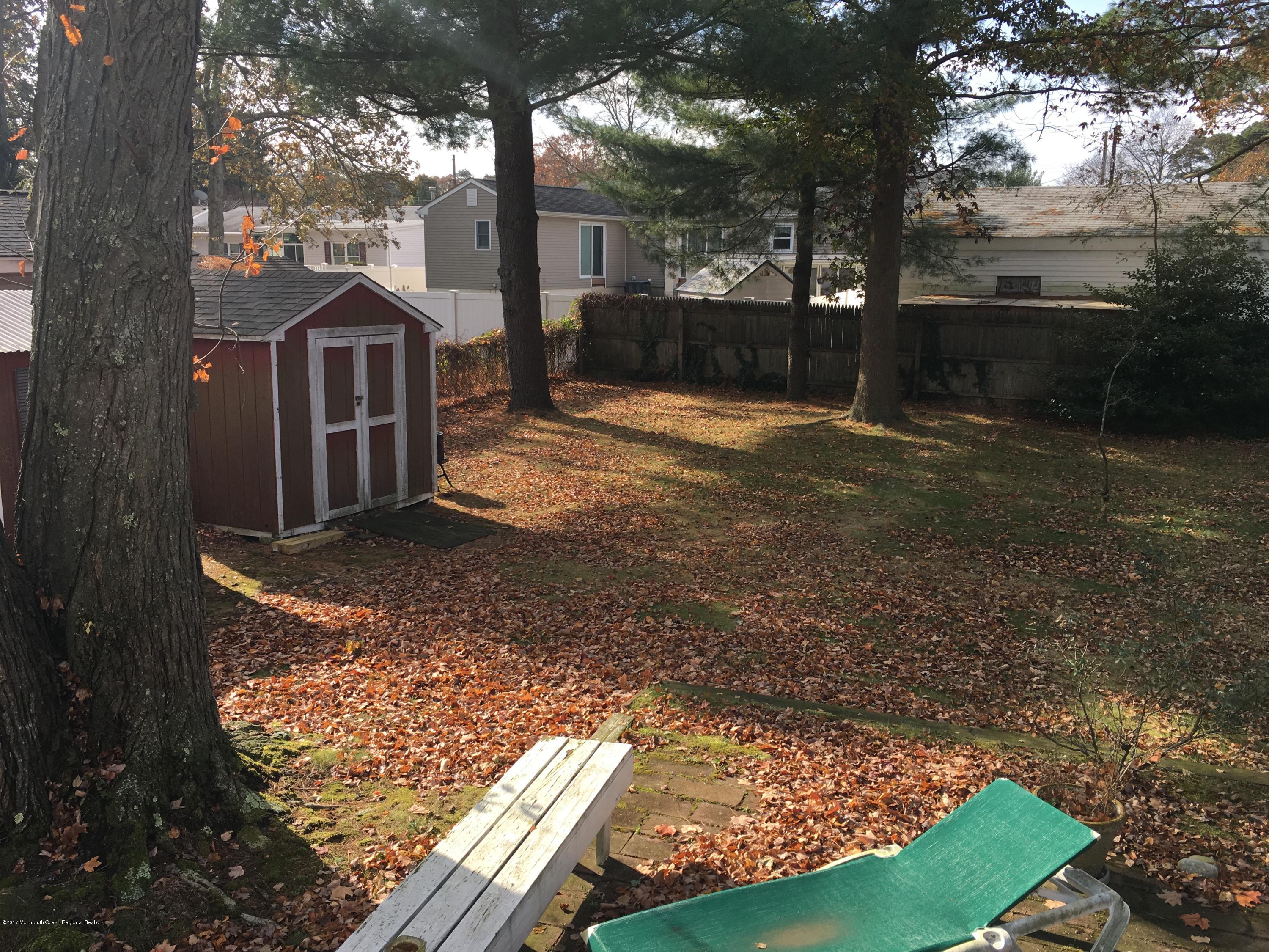 320 Eastham Road Point Pleasant, NJ 08742 - Photo 16 of 18 a view of a yard with large trees