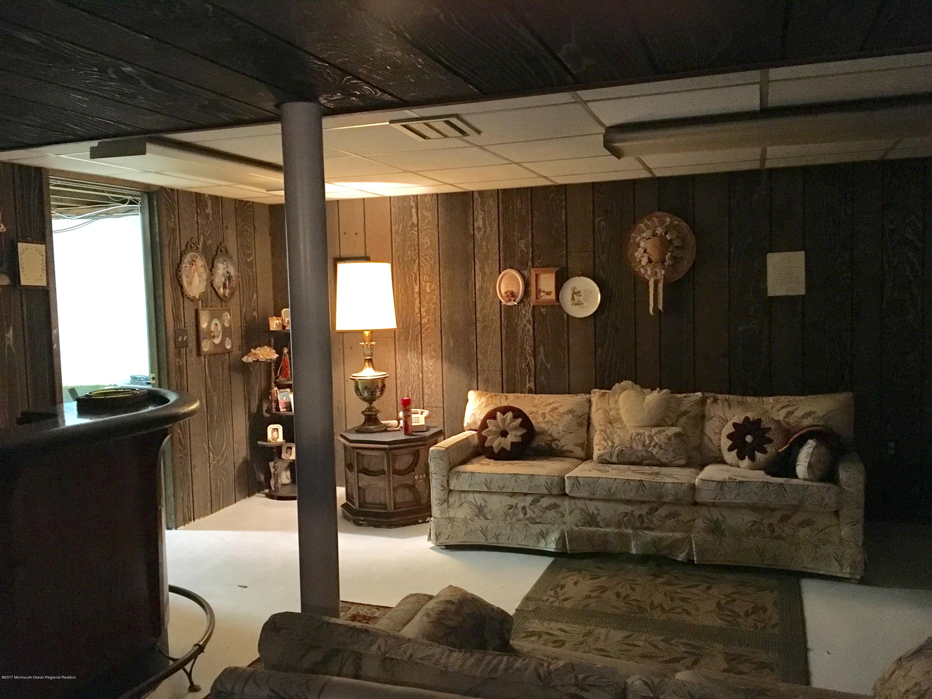 320 Eastham Road Point Pleasant, NJ 08742 - Photo 6 of 18 a living room with furniture and a window