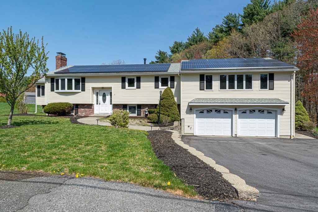 5 Shalloo Road Billerica, MA 01821 - Photo 1 of 42 a front view of a house with a yard and potted plants