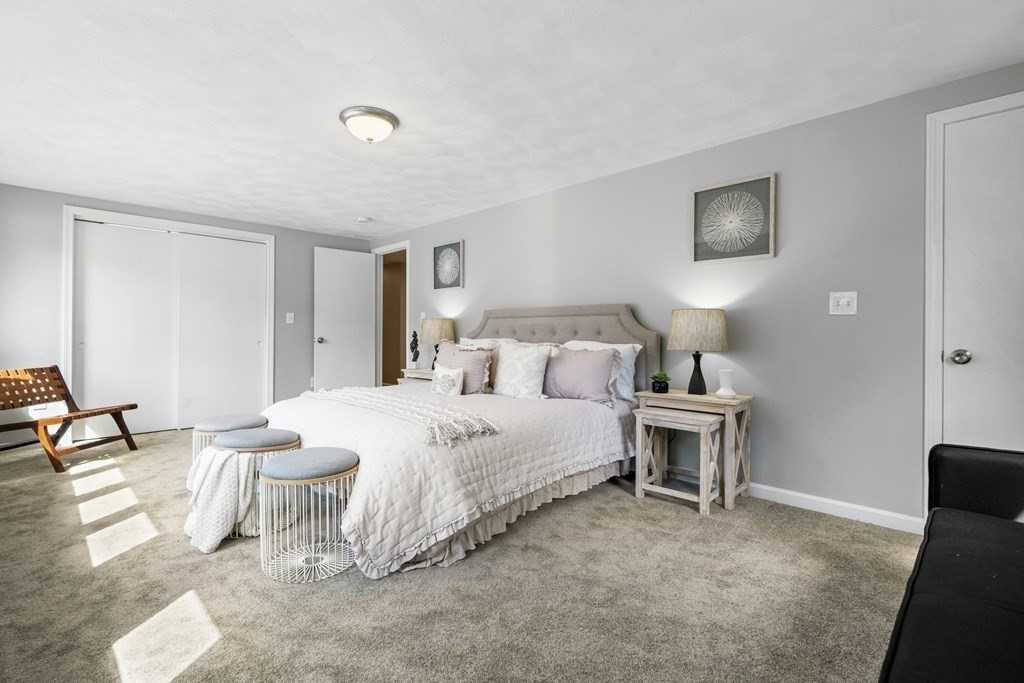 5 Shalloo Road Billerica, MA 01821 - Photo 15 of 42 a spacious bedroom with a bed and a lamp