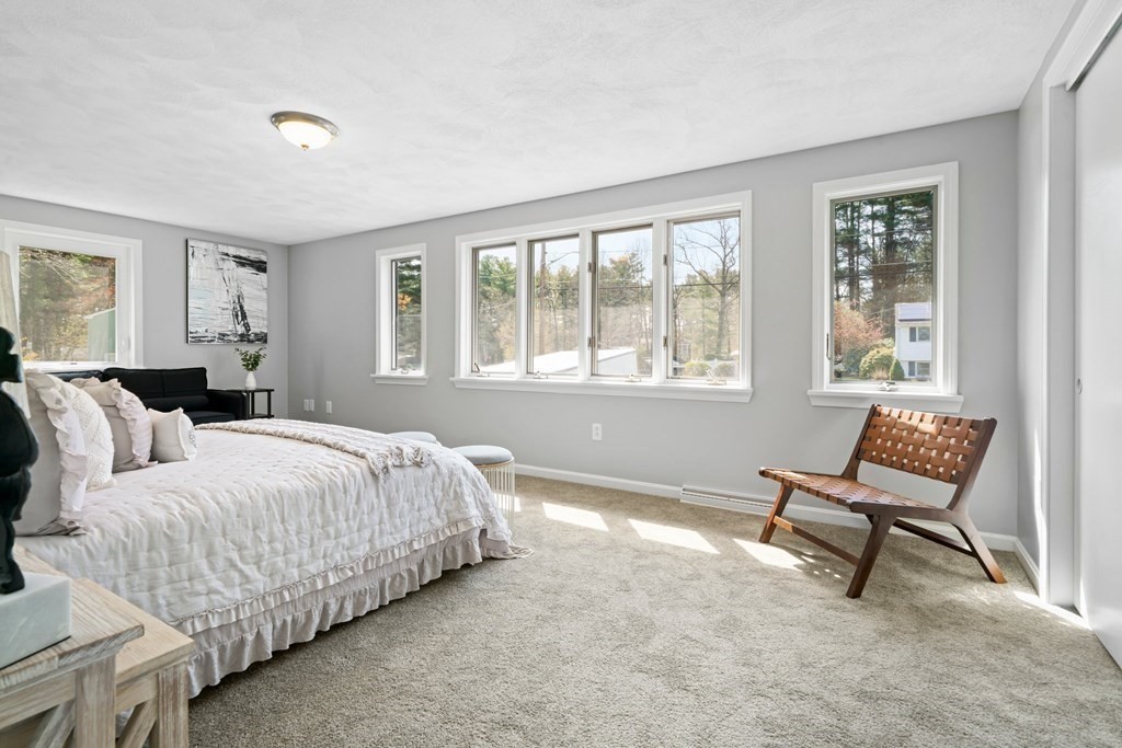 5 Shalloo Road Billerica, MA 01821 - Photo 16 of 42 a spacious bedroom with a bed and a window