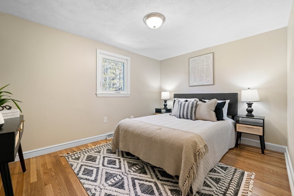 5 Shalloo Road Billerica, MA 01821 - Photo 17 of 42 a bedroom with a bed and wooden floor