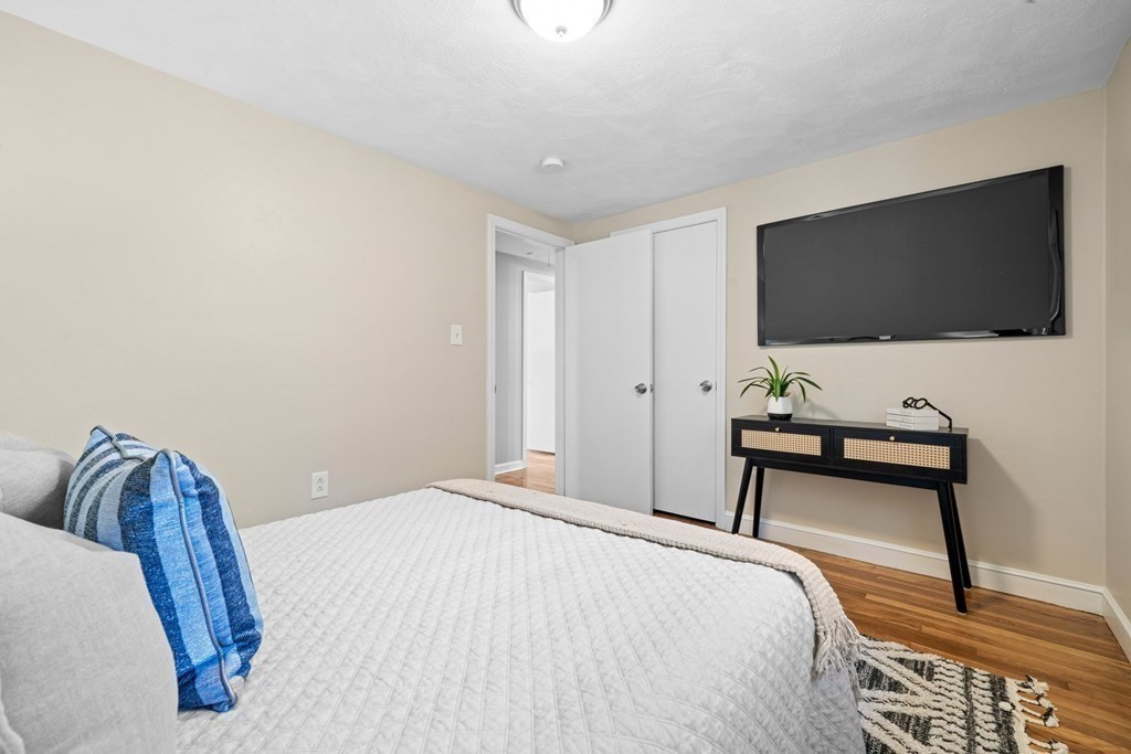 5 Shalloo Road Billerica, MA 01821 - Photo 18 of 42 a bedroom with a bed and a flat screen tv