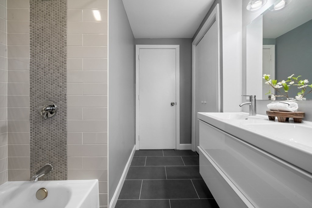 5 Shalloo Road Billerica, MA 01821 - Photo 20 of 42 a bathroom with a sink a toilet a shower and a bathtub