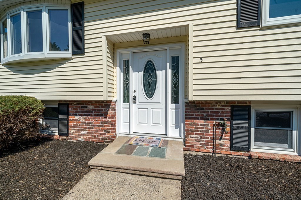5 Shalloo Road Billerica, MA 01821 - Photo 2 of 42 a front view of a house with a garden