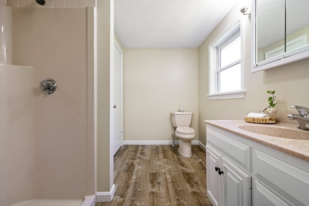 5 Shalloo Road Billerica, MA 01821 - Photo 27 of 42 a bathroom with a sink a toilet and a window