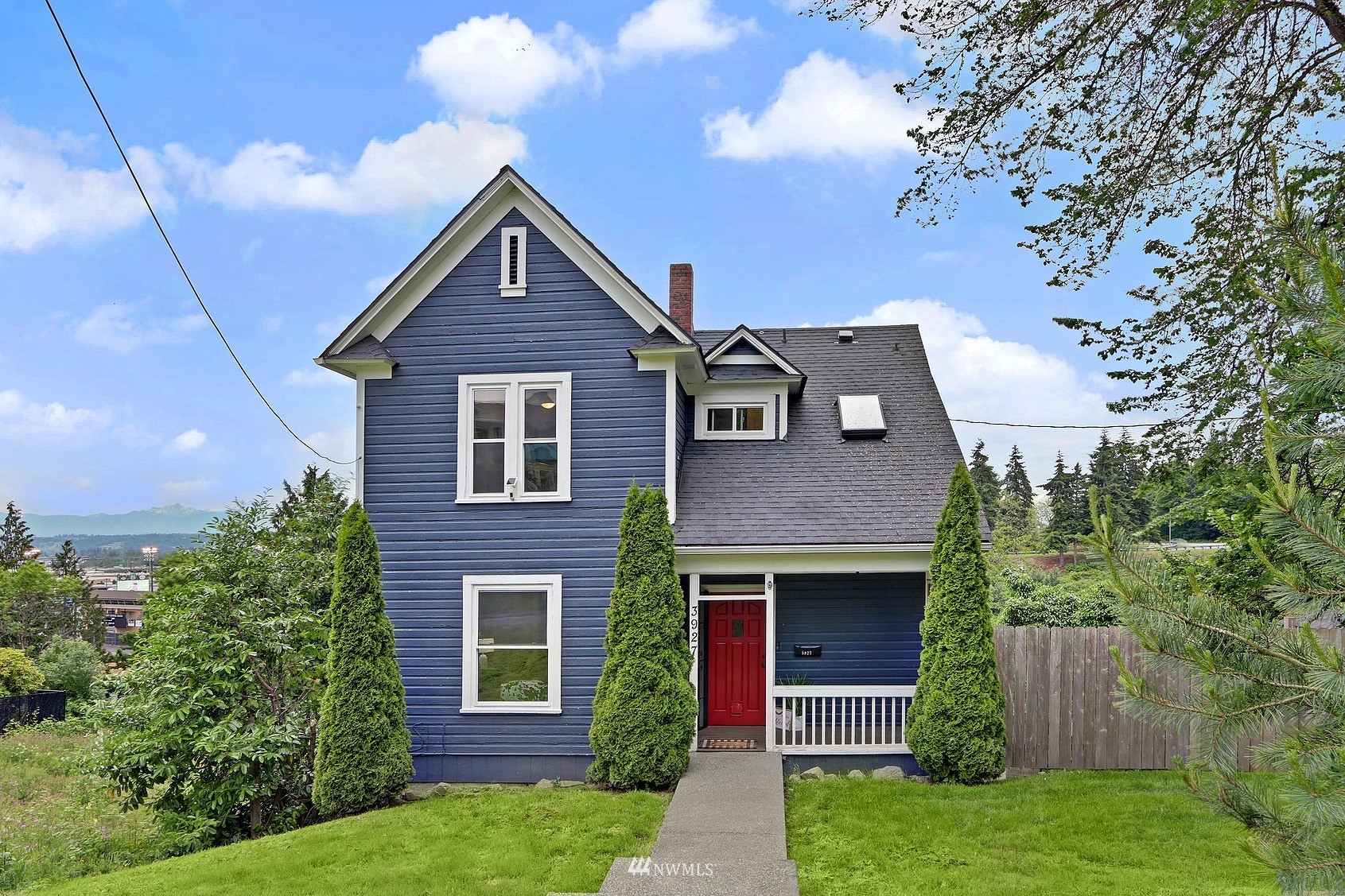 3927 Wetmore Avenue Everett, WA 98201 - Photo 1 of 26 a front view of a house with garden