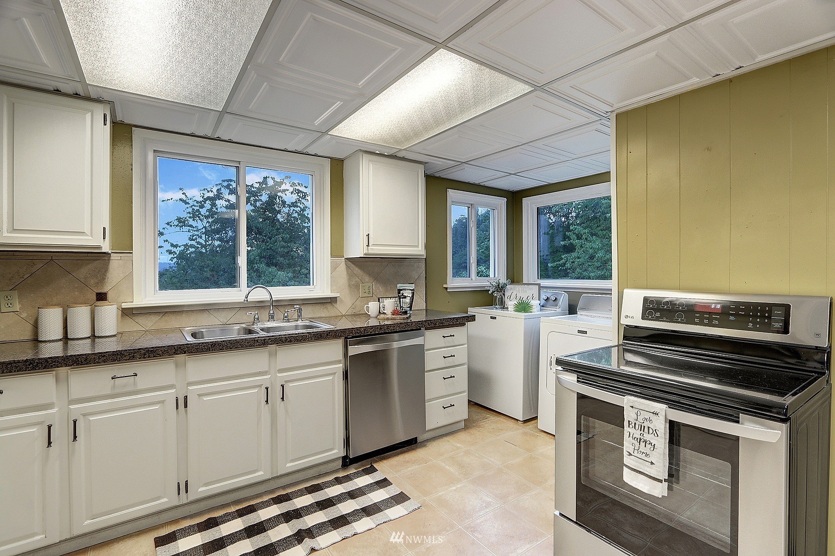 3927 Wetmore Avenue Everett, WA 98201 - Photo 12 of 26 a kitchen that has a sink and a stove