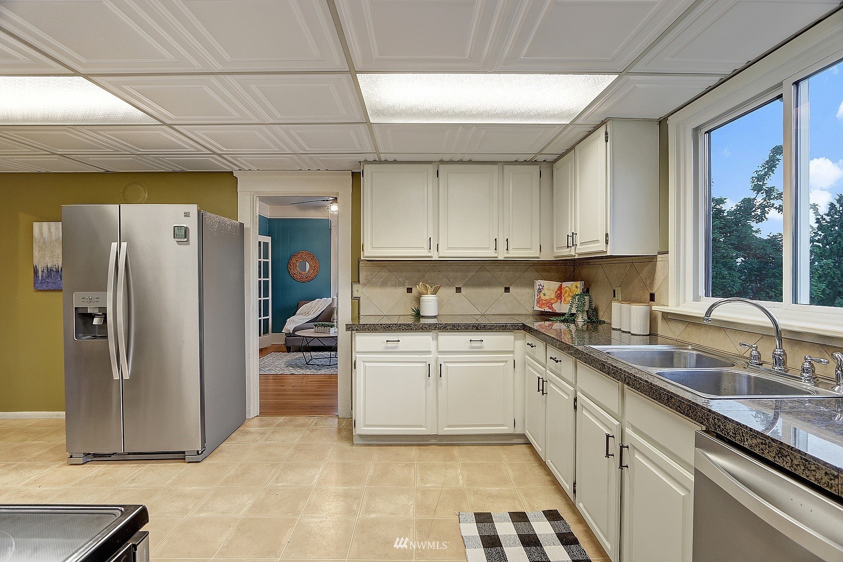 3927 Wetmore Avenue Everett, WA 98201 - Photo 13 of 26 a kitchen with a sink appliances and cabinets