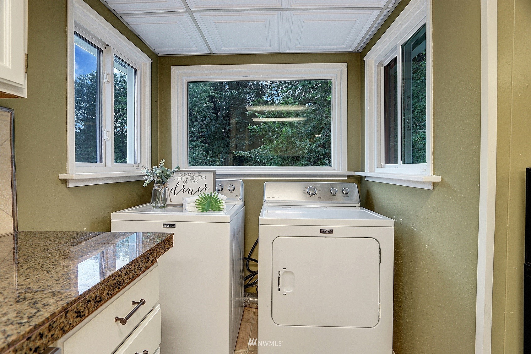 3927 Wetmore Avenue Everett, WA 98201 - Photo 16 of 26 a view of a kitchen that has a sink and a stove in it