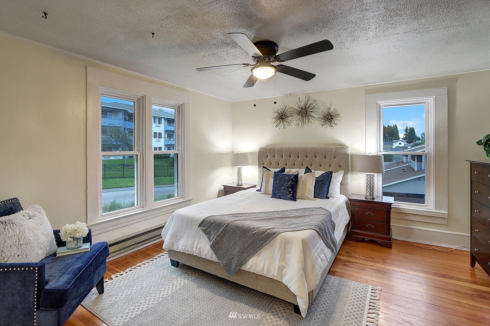 3927 Wetmore Avenue Everett, WA 98201 - Photo 17 of 26 a bedroom with a bed and wooden floor