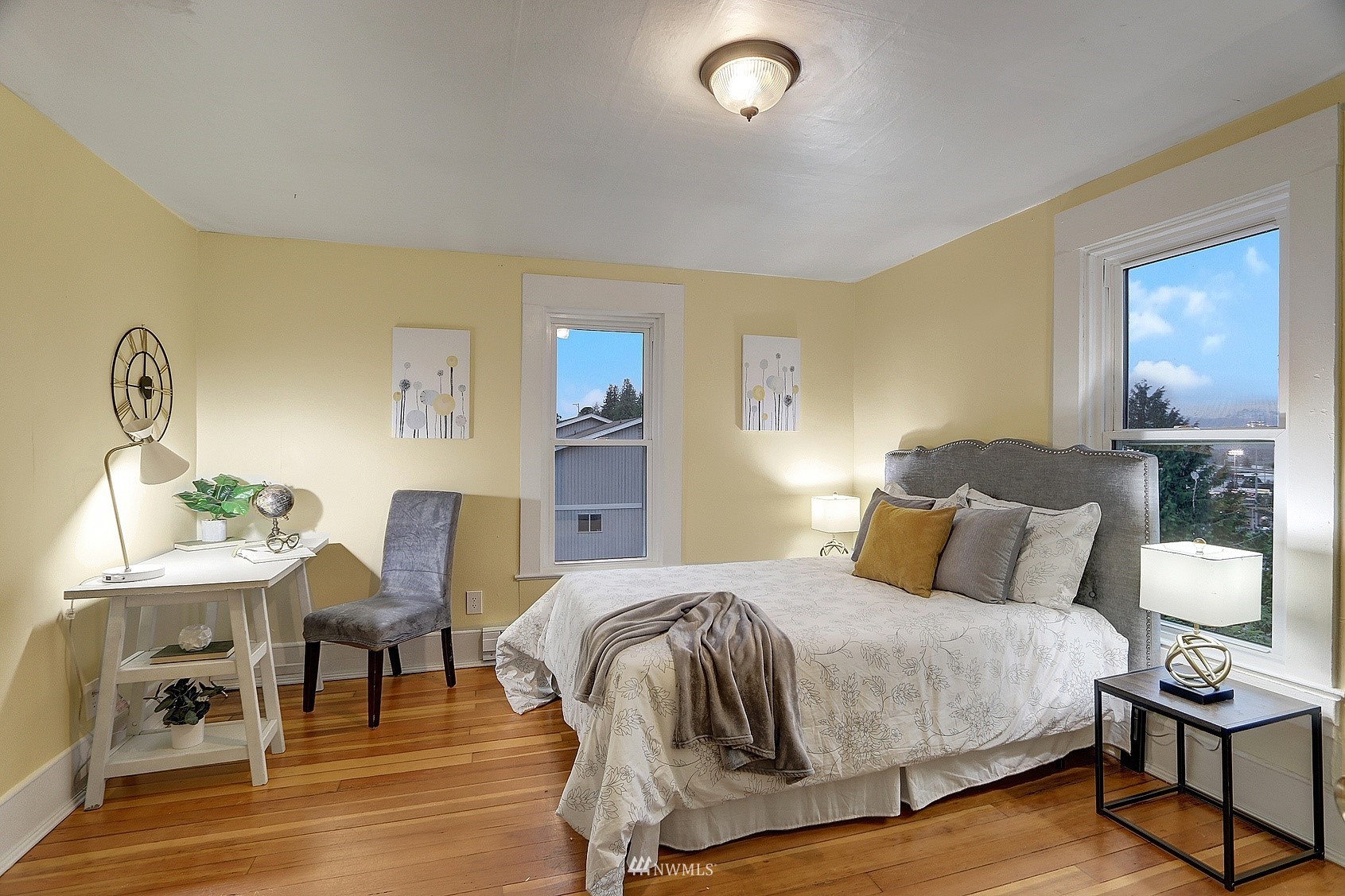 3927 Wetmore Avenue Everett, WA 98201 - Photo 19 of 26 a bedroom with a bed and wooden floor