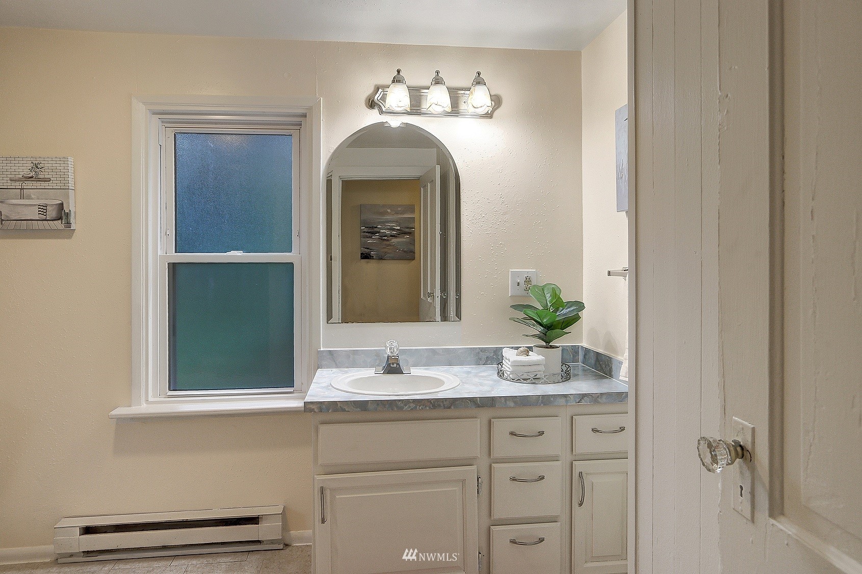 3927 Wetmore Avenue Everett, WA 98201 - Photo 20 of 26 a bathroom with a sink and a mirror