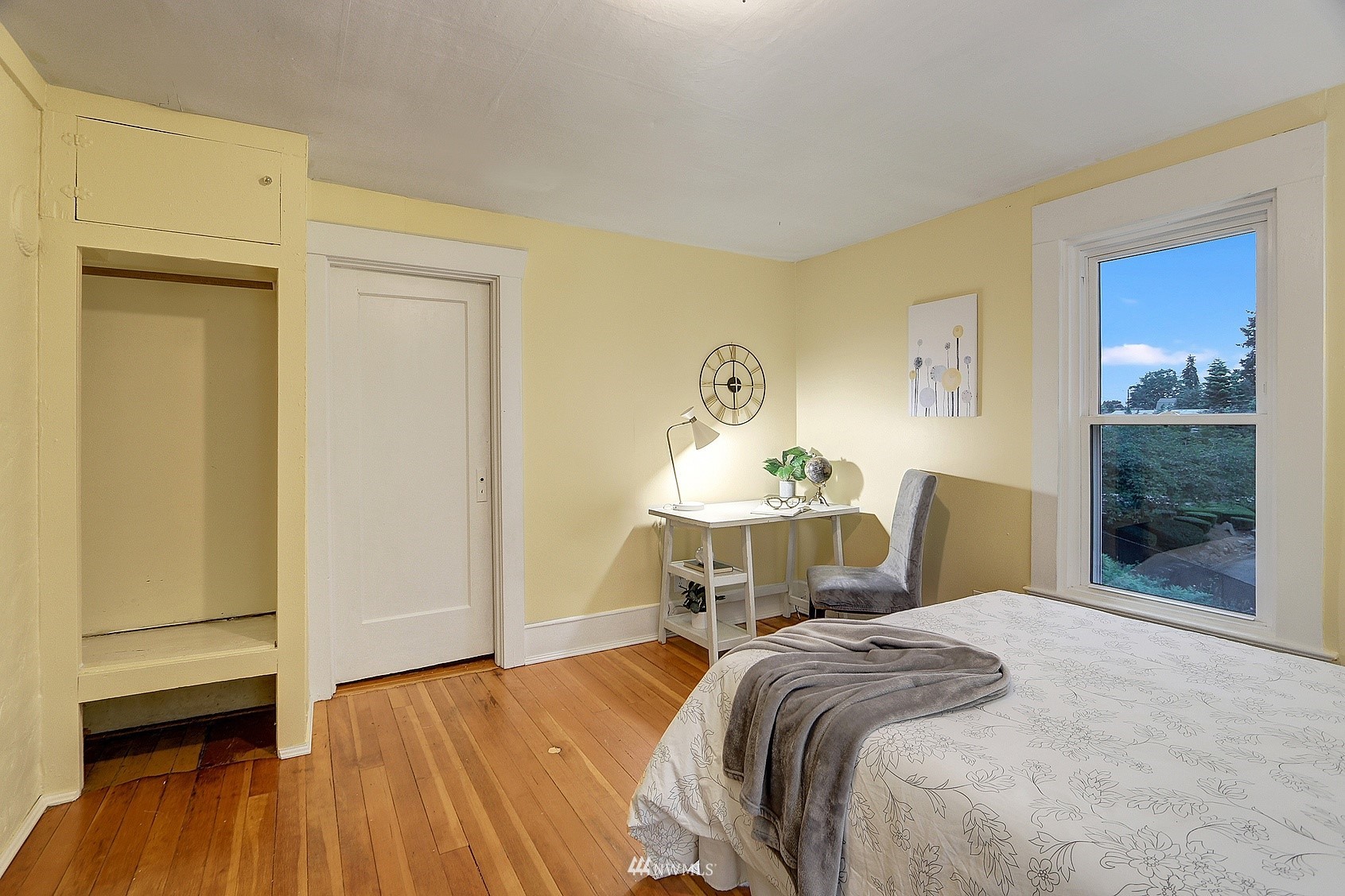 3927 Wetmore Avenue Everett, WA 98201 - Photo 26 of 26 a bedroom with a bed and wooden floor