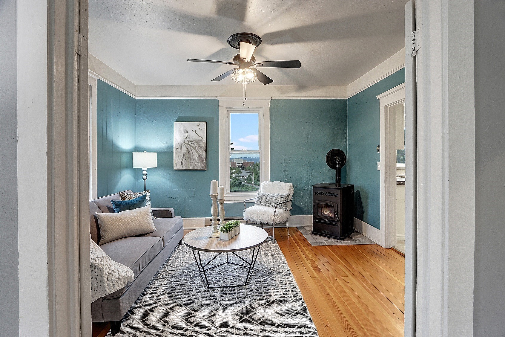 3927 Wetmore Avenue Everett, WA 98201 - Photo 8 of 26 a living room with furniture and a chandelier