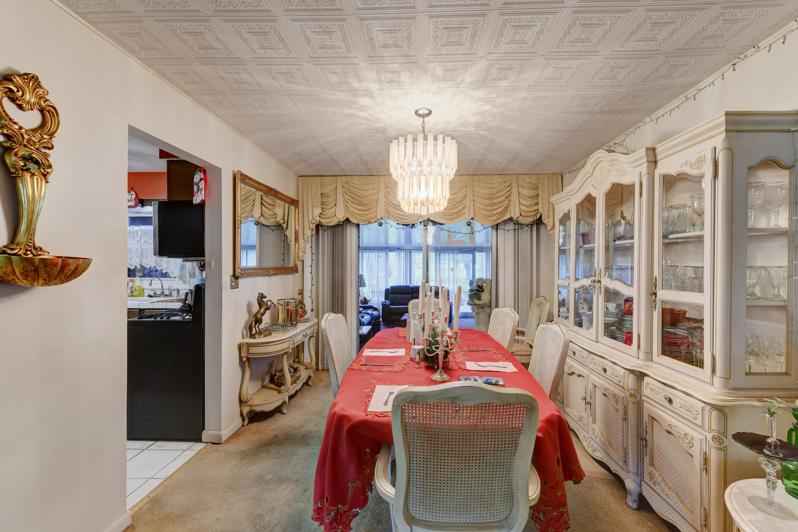 126 Denell Drive Crete, IL 60417 - Photo 12 of 30 a view of a dining room with furniture a chandelier and large window