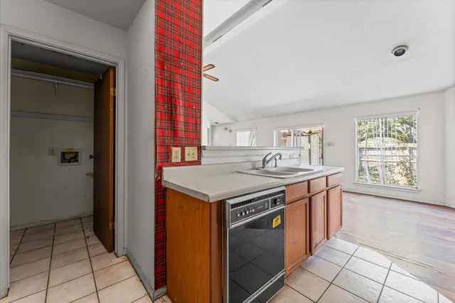 a kitchen with a stove and a sink