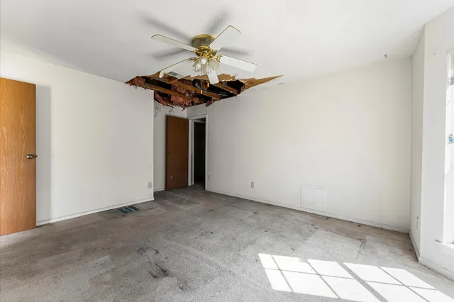 a view of a hallway with a chandelier
