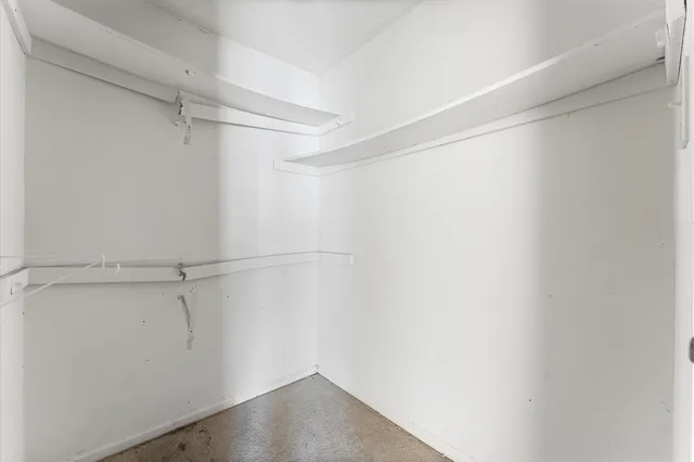 a view of an empty walk in closet