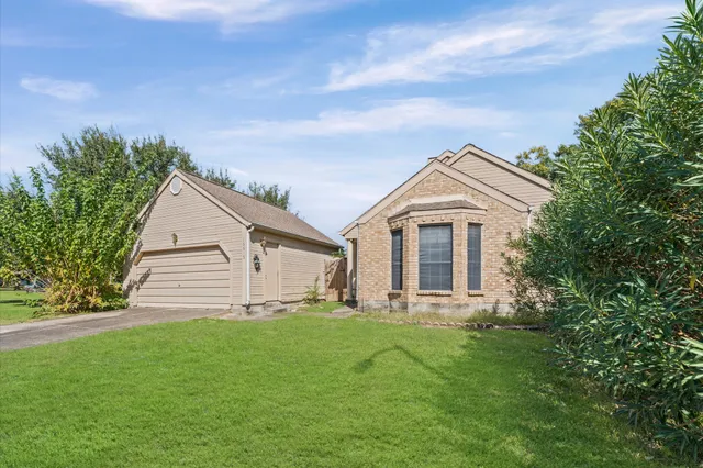 a view of a house with a yard