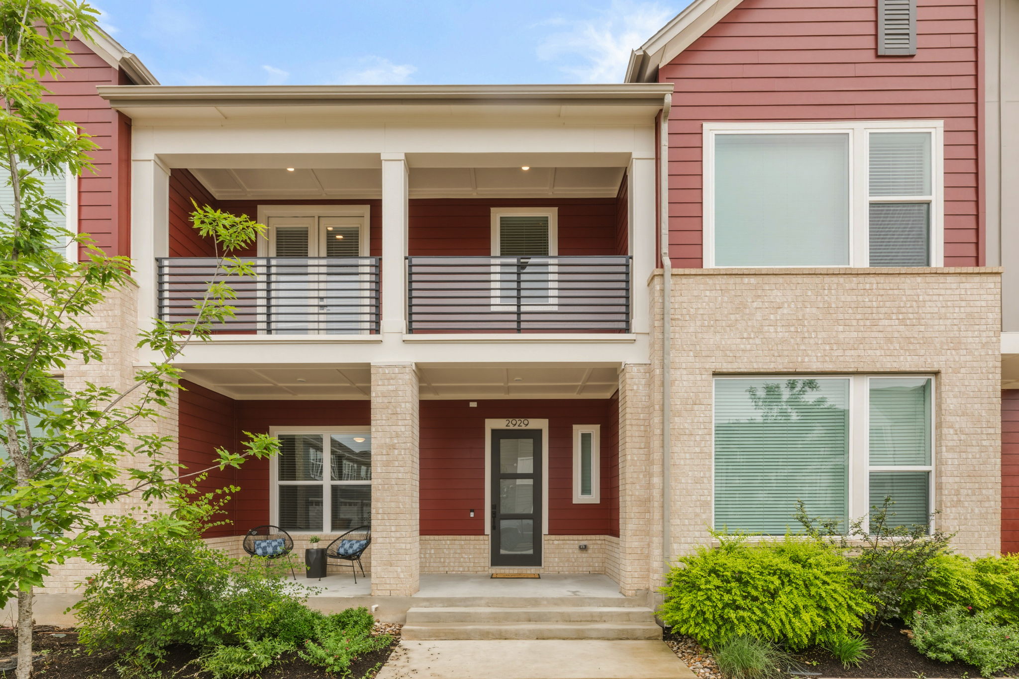 2929 Moreno Street Austin, TX 78723 - Photo 3 of 40 Contemporary multi-level facade featuring red siding and light brick accents