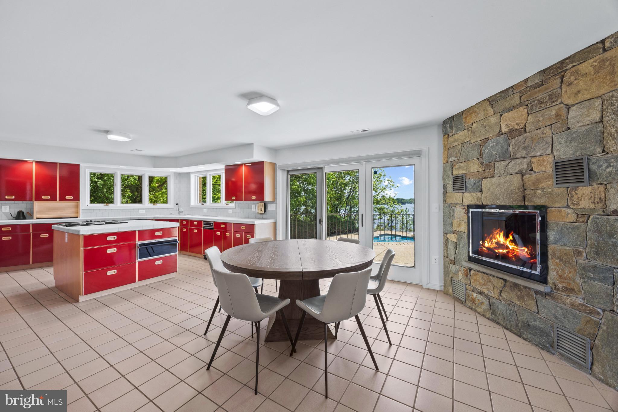 31 Shadow Point Court Edgewater, MD 21037 - Photo 11 of 44 Kitchen with dining area and fireplace