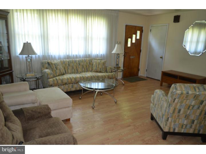 520 8 Street Riverside, NJ 08075 - Photo 3 of 14 a living room with furniture and a window