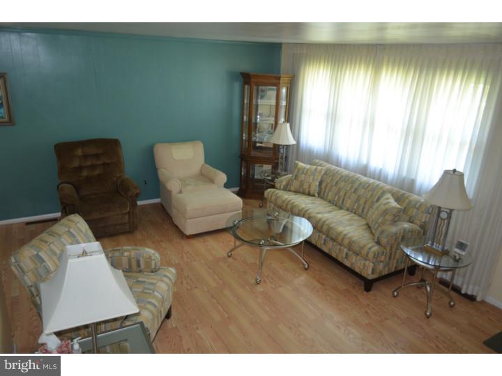 520 8 Street Riverside, NJ 08075 - Photo 4 of 14 a living room with furniture and a large window