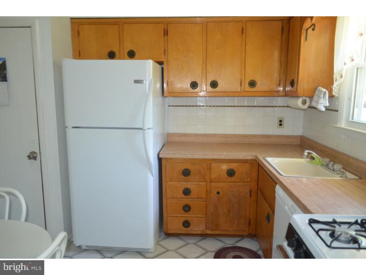 520 8 Street Riverside, NJ 08075 - Photo 8 of 14 a white refrigerator freezer sitting inside of a kitchen