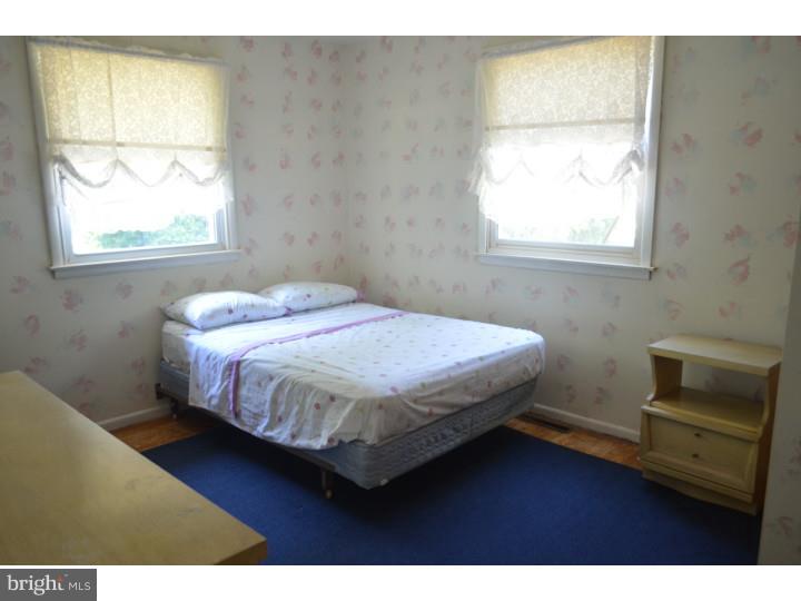 520 8 Street Riverside, NJ 08075 - Photo 10 of 14 a bedroom with a bed and a window