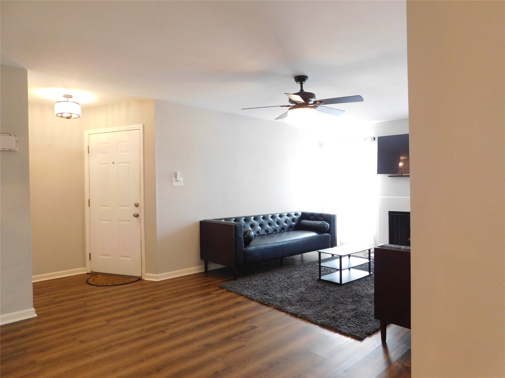 10101 South Gessner Road, Unit 912 Houston, TX 77071 - Photo 7 of 47 a view of a livingroom with furniture and a ceiling fan
